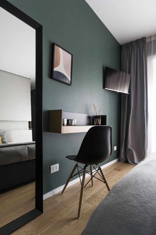 Design ideas for a medium sized scandi master bedroom with grey walls and light hardwood flooring.