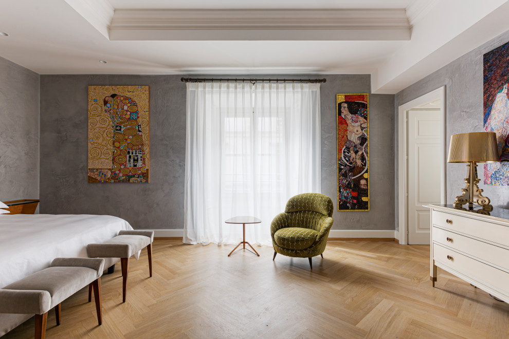 Example of a large minimalist master bedroom design in Milan with gray walls