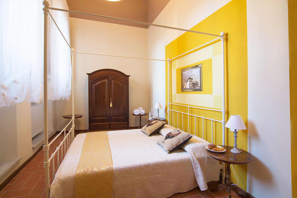 Example of a cottage bedroom design in Florence