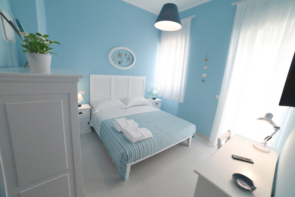 Example of a small beach style bedroom design in Other