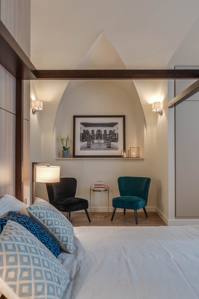 Bedroom - large contemporary master light wood floor and beige floor bedroom idea in Florence with white walls