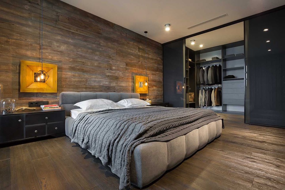 Modelo de dormitorio tipo loft industrial con suelo de baldosas de cerámica y suelo marrón