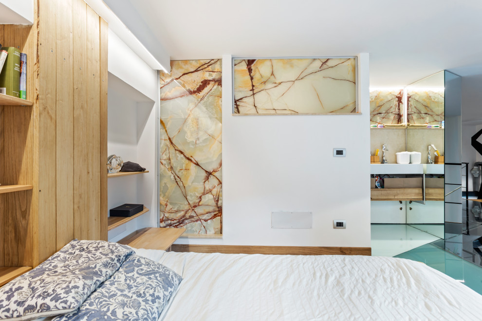 Immagine di una camera da letto stile loft contemporanea di medie dimensioni con pareti bianche