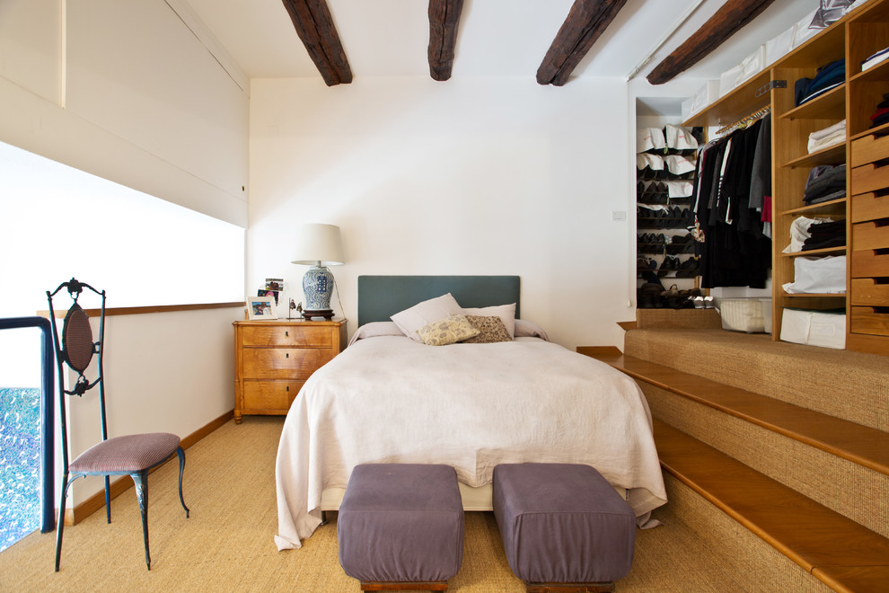 Photo of a medium sized bohemian master bedroom in Naples with white walls, carpet and beige floors.