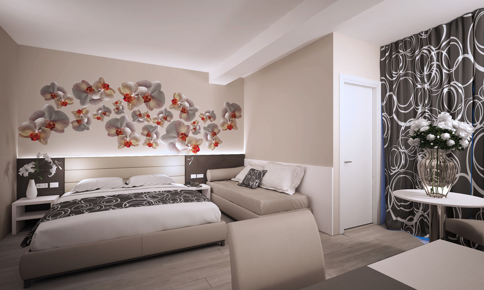 This is an example of a contemporary bedroom in Bologna with vinyl flooring.