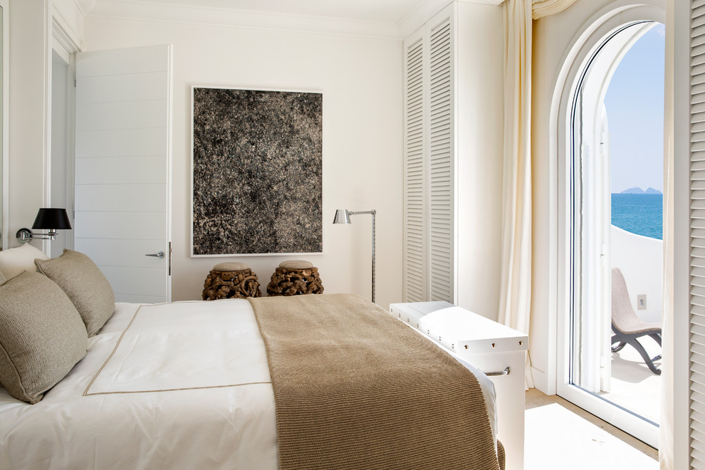 Design ideas for a mediterranean master bedroom in Rome with white walls and no fireplace.