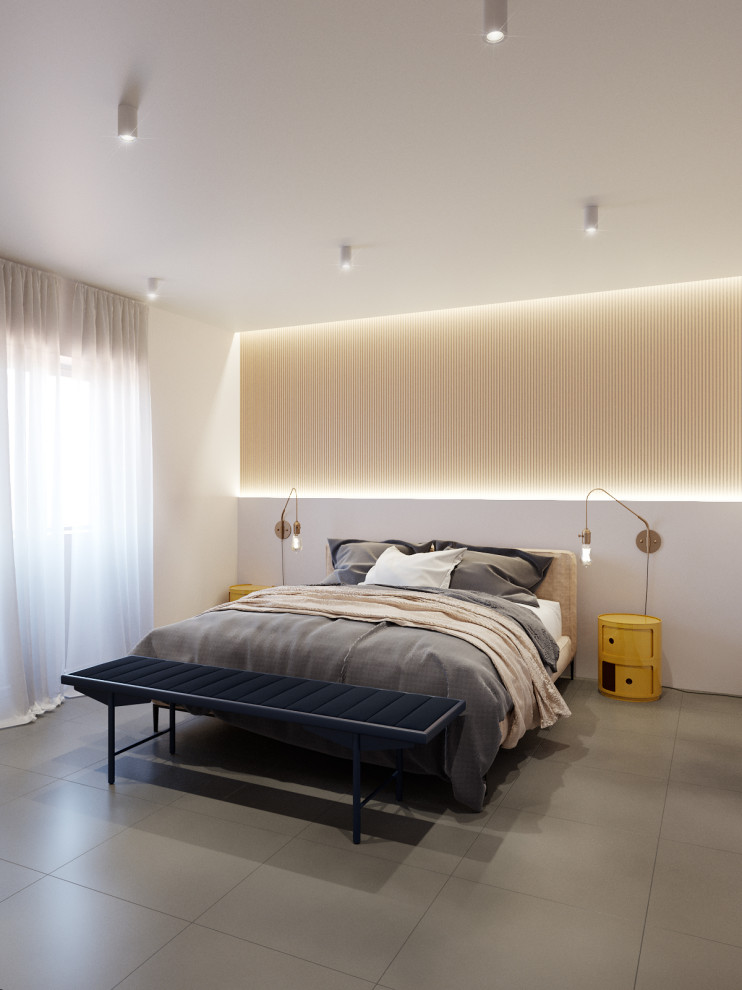 Exemple d'une chambre parentale tendance de taille moyenne avec un mur blanc, un sol en carrelage de porcelaine et un sol gris.