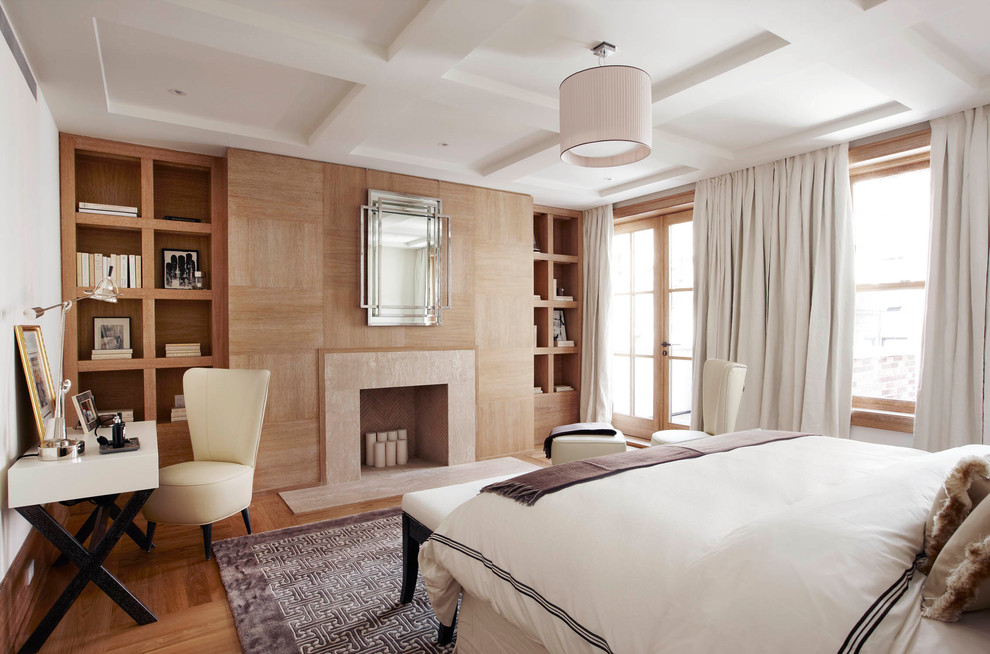 Inspiration for a classic grey and brown bedroom in New York with brown walls, medium hardwood flooring, a standard fireplace and brown floors.