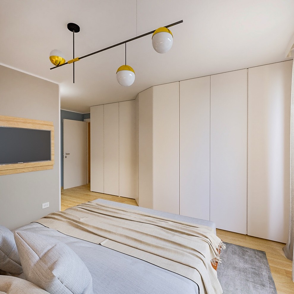 Example of a mid-sized trendy master light wood floor bedroom design in Milan with multicolored walls