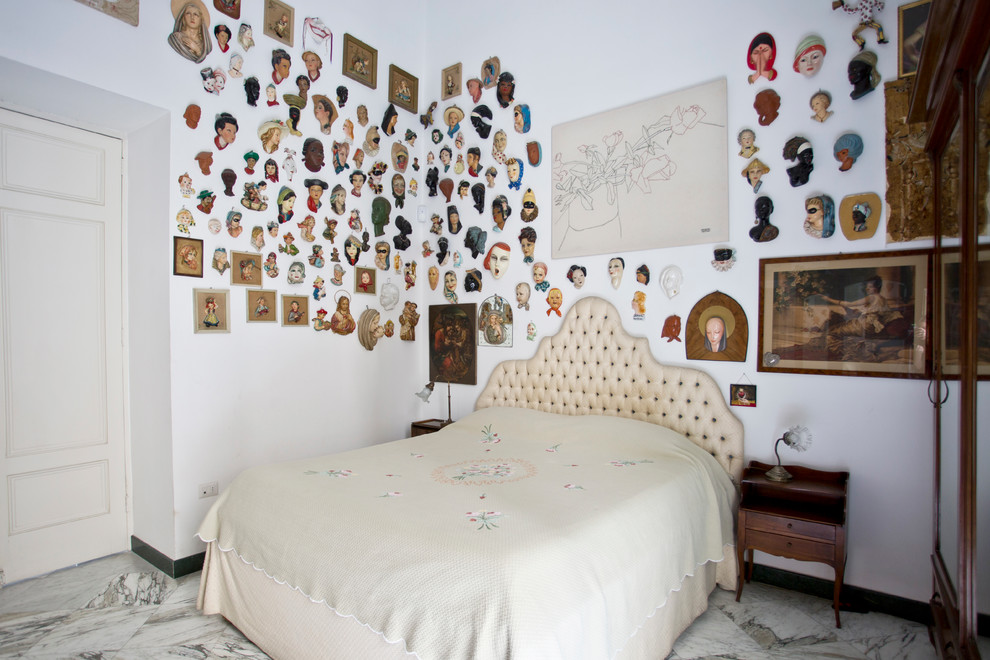 This is an example of a medium sized eclectic master bedroom in Naples with white walls and marble flooring.