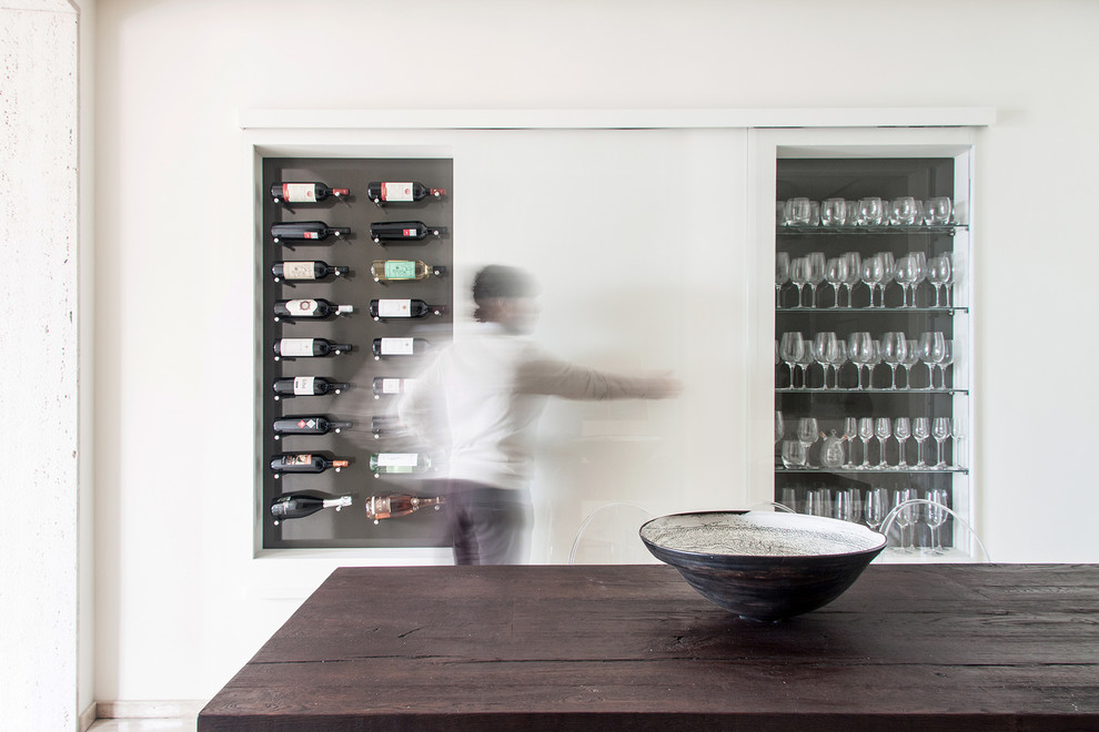 Small contemporary wine cellar in Cagliari with display racks.