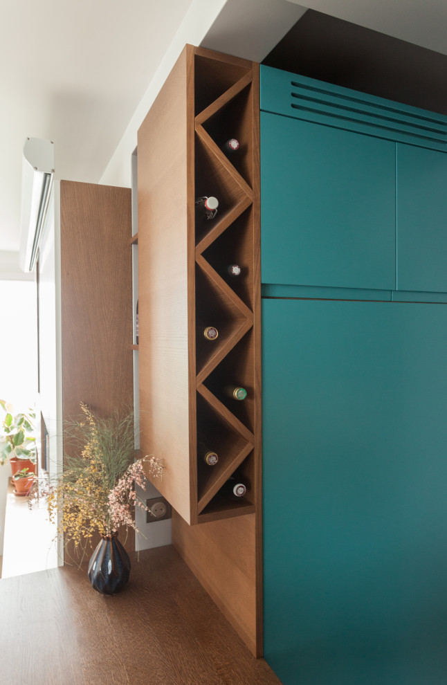 This is an example of a small contemporary wine cellar in Paris with cube storage.