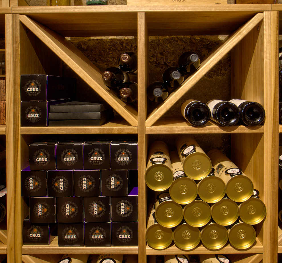 Wine cellar - small traditional slate floor wine cellar idea in Paris with diamond bins
