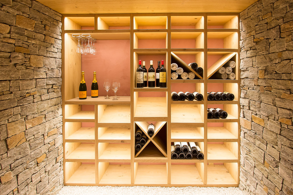 Medium sized contemporary wine cellar in Lyon with storage racks.