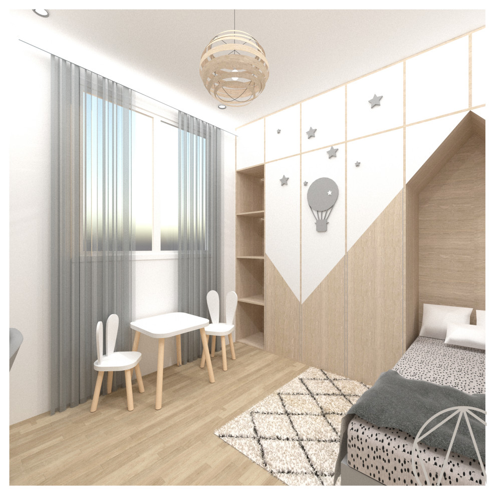 Immagine di una cameretta per bambini da 4 a 10 anni scandinava di medie dimensioni con pareti bianche, parquet chiaro, pavimento beige e carta da parati