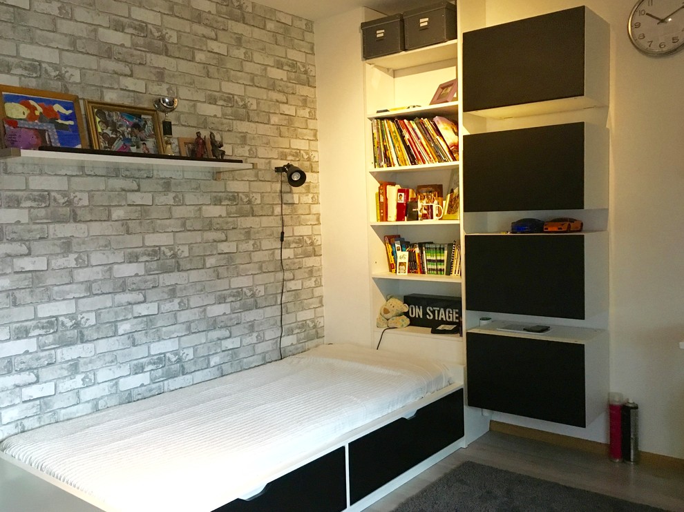 Photo of a small contemporary teen’s room for boys in Strasbourg with white walls, laminate floors and beige floors.