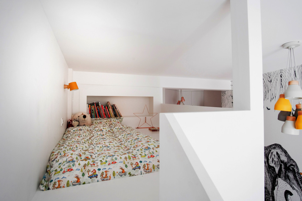 Playroom - contemporary gender-neutral playroom idea in Paris with white walls