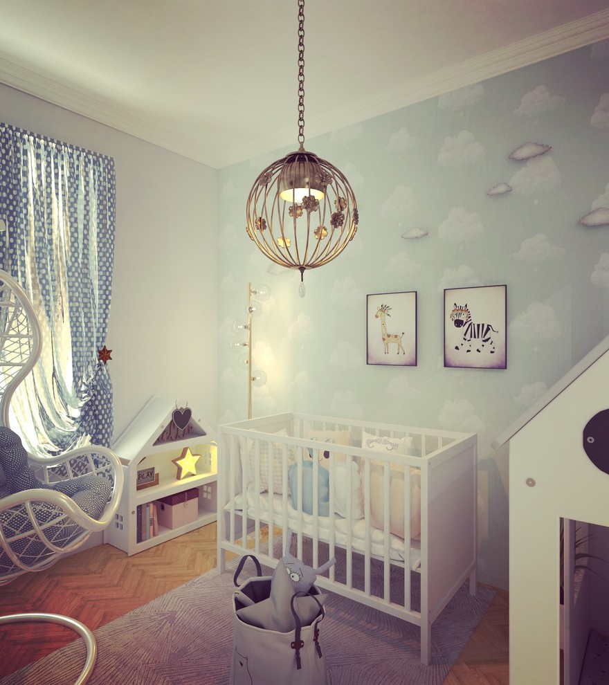 Idée de décoration pour une petite chambre de bébé garçon design avec un mur bleu, parquet clair et un sol marron.