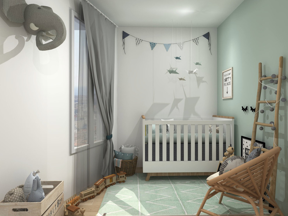 Inspiration for a medium sized scandi gender neutral nursery in Lyon with green walls, light hardwood flooring and beige floors.