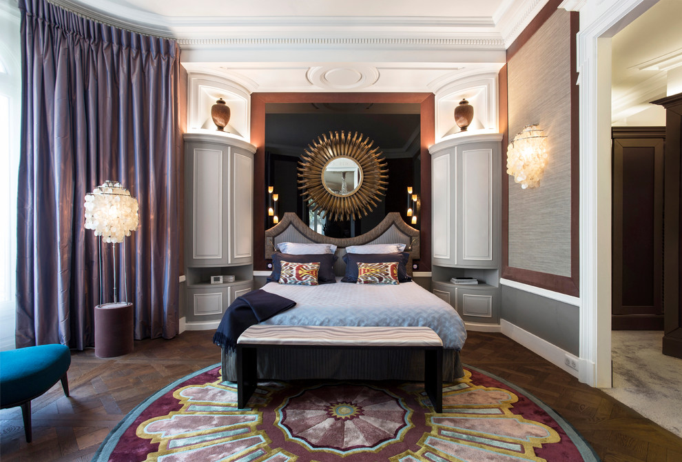 Transitional medium tone wood floor and brown floor bedroom photo in Paris with gray walls