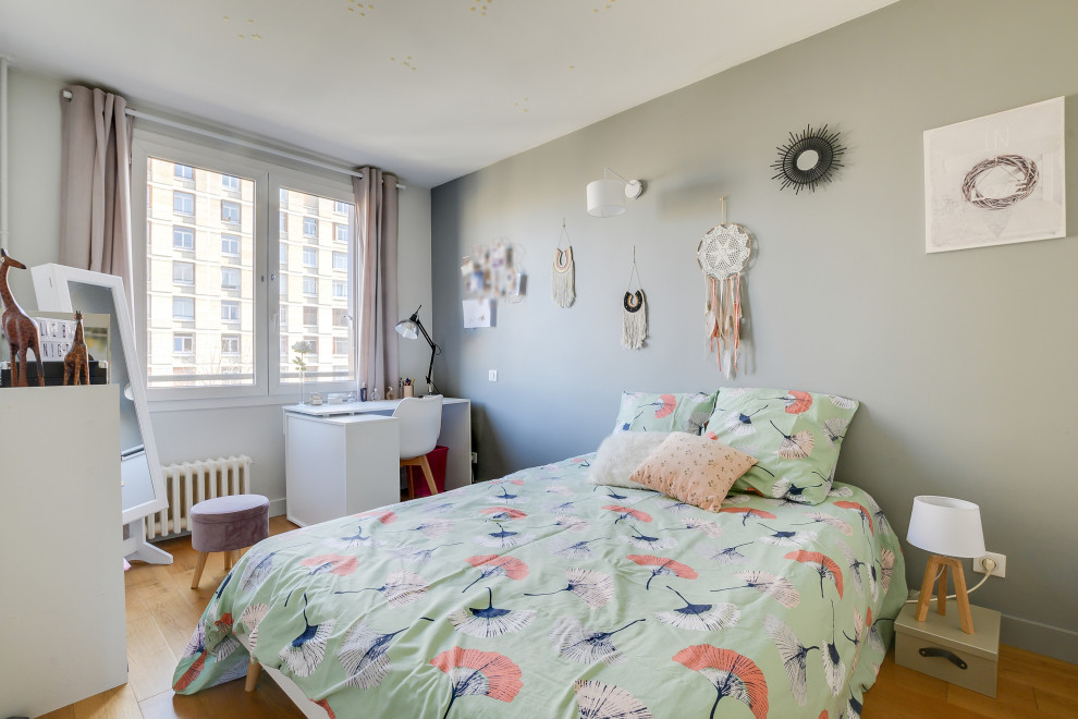 Inspiration for a medium sized scandinavian bedroom in Paris with grey walls, medium hardwood flooring, no fireplace and brown floors.