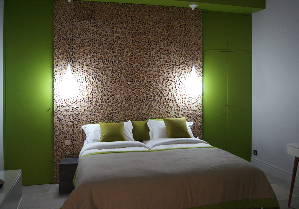 Scandi bedroom in Montpellier with green walls and limestone flooring.