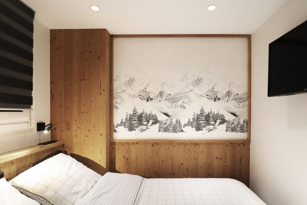 Cette photo montre une petite chambre montagne avec du papier peint.