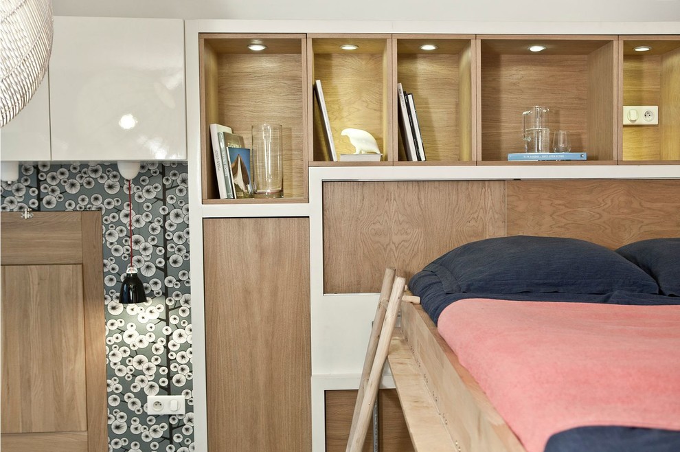 Mid-sized trendy master medium tone wood floor bedroom photo in Paris with white walls