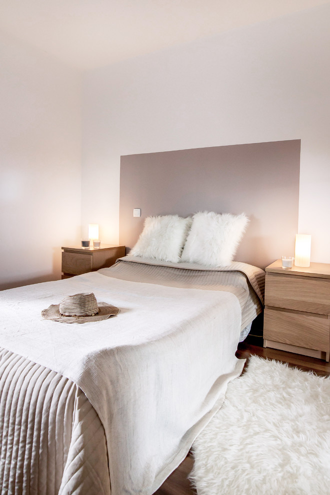 Danish master dark wood floor bedroom photo in Toulouse with beige walls