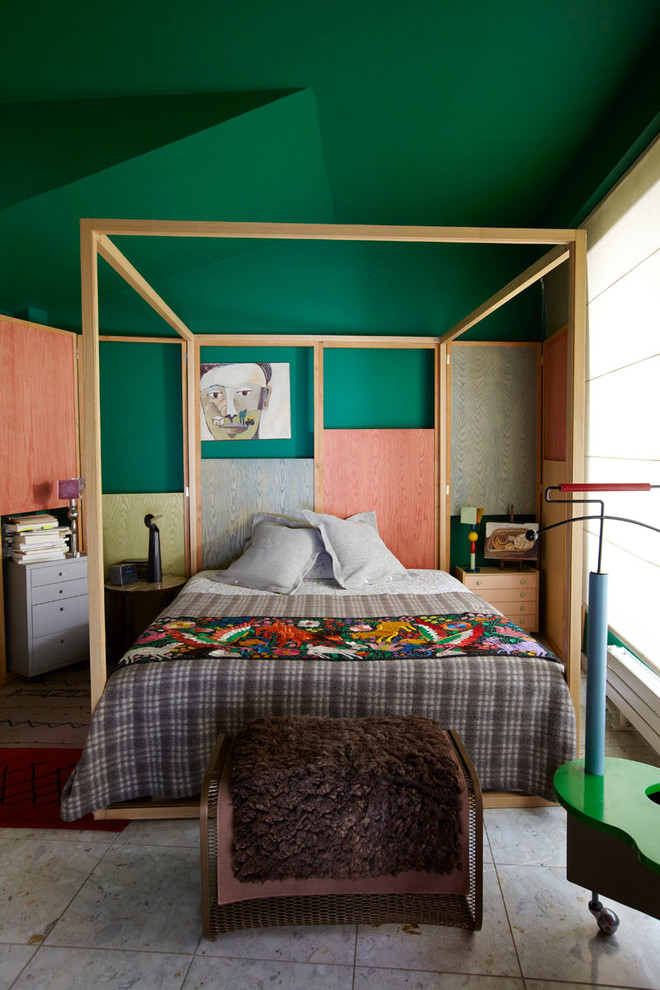 This is an example of an eclectic bedroom in Paris with green walls and no fireplace.