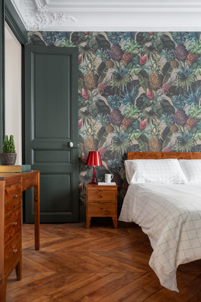 Trendy master dark wood floor and brown floor bedroom photo in Paris with green walls