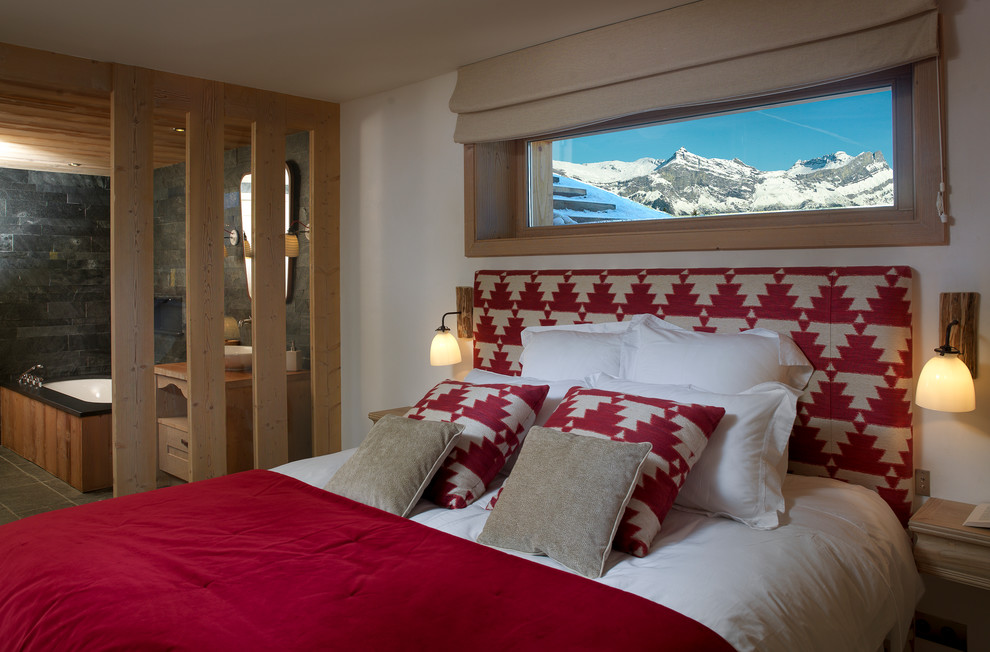 Example of a mountain style bedroom design in Paris with white walls