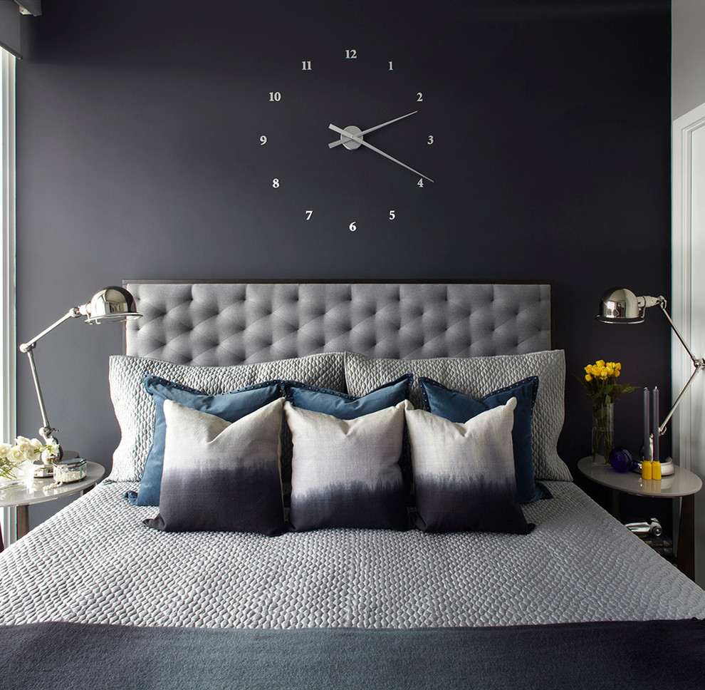 Example of a transitional bedroom design in Toronto with black walls