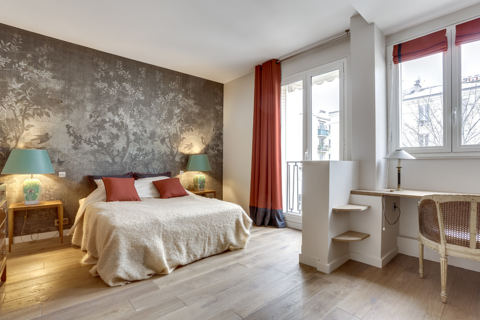 Contemporary bedroom in Paris with grey walls, light hardwood flooring and beige floors.