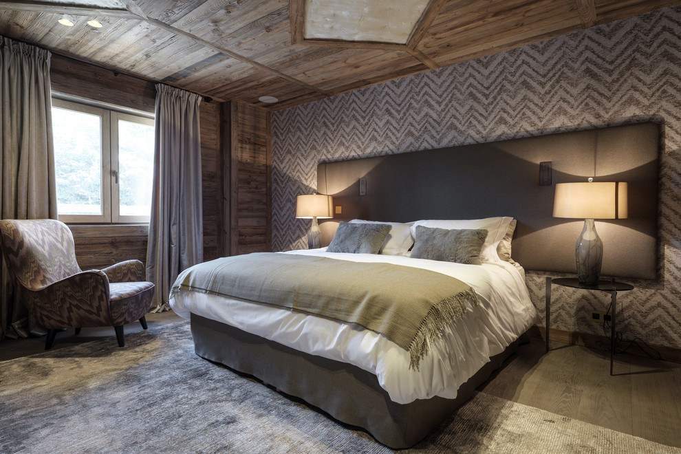 This is an example of a rustic bedroom in Lyon with multi-coloured walls.