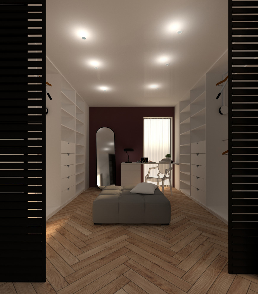 Diseño de dormitorio principal actual de tamaño medio con suelo de madera clara