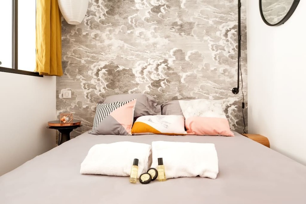 Bedroom - small 1950s master light wood floor and beige floor bedroom idea in Lyon with gray walls