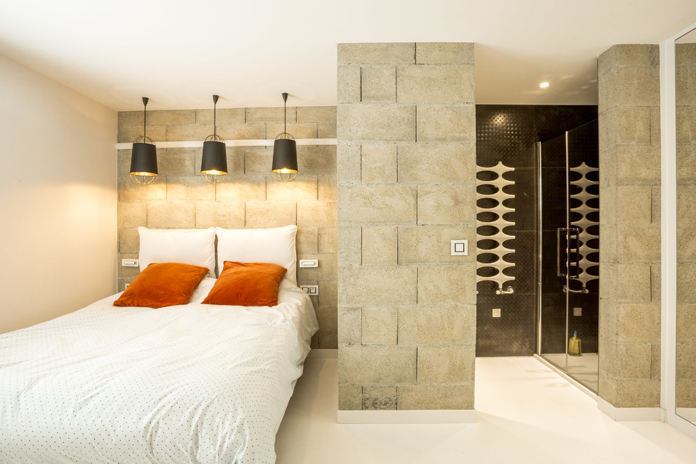 Ejemplo de habitación de invitados actual pequeña con paredes grises, suelo blanco y suelo de cemento