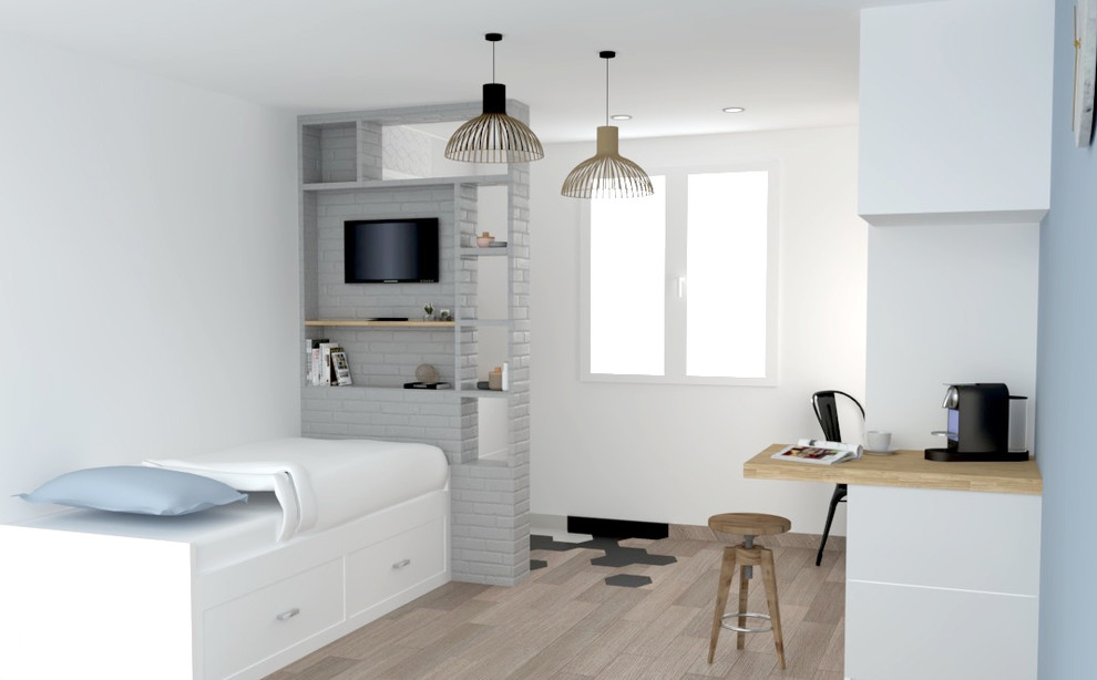 Small scandinavian bedroom in Lyon with white walls, light hardwood flooring, no fireplace and brown floors.