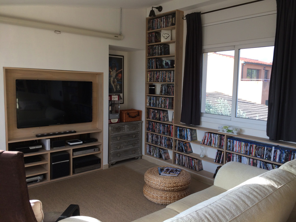 This is an example of a medium sized mediterranean enclosed home cinema in Other with white walls, ceramic flooring, a built-in media unit and beige floors.