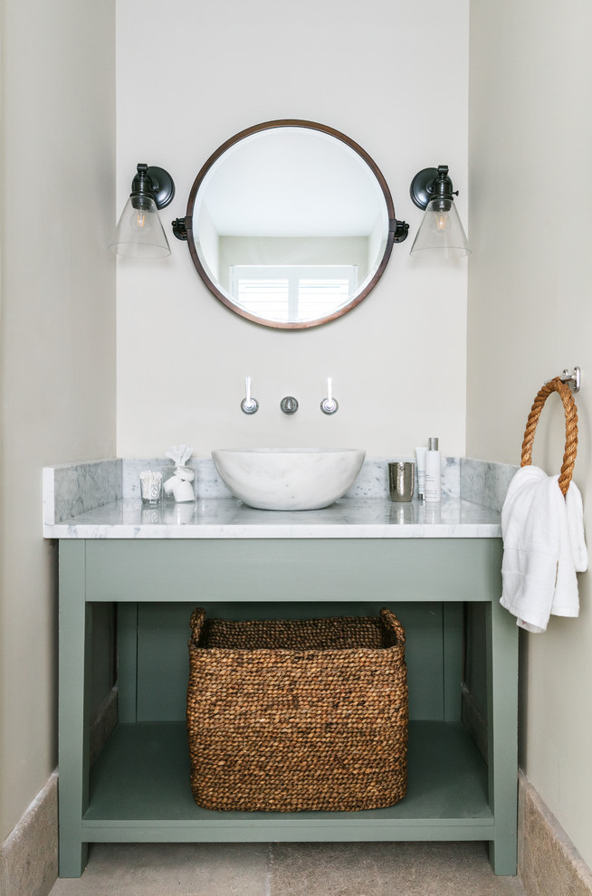 Small coastal cloakroom in Sussex with open cabinets, green cabinets, white walls, a vessel sink, beige floors and white worktops.