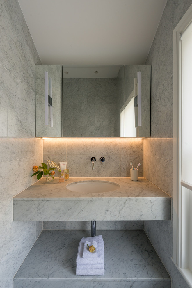 Design ideas for a contemporary cloakroom in London with grey tiles, a submerged sink, marble worktops and white worktops.
