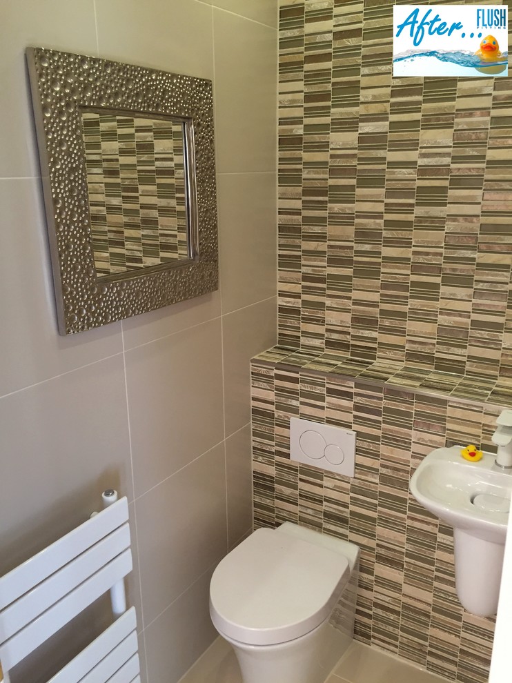 This is an example of a small contemporary cloakroom in West Midlands with a one-piece toilet, beige tiles, porcelain tiles, beige walls, porcelain flooring and a wall-mounted sink.