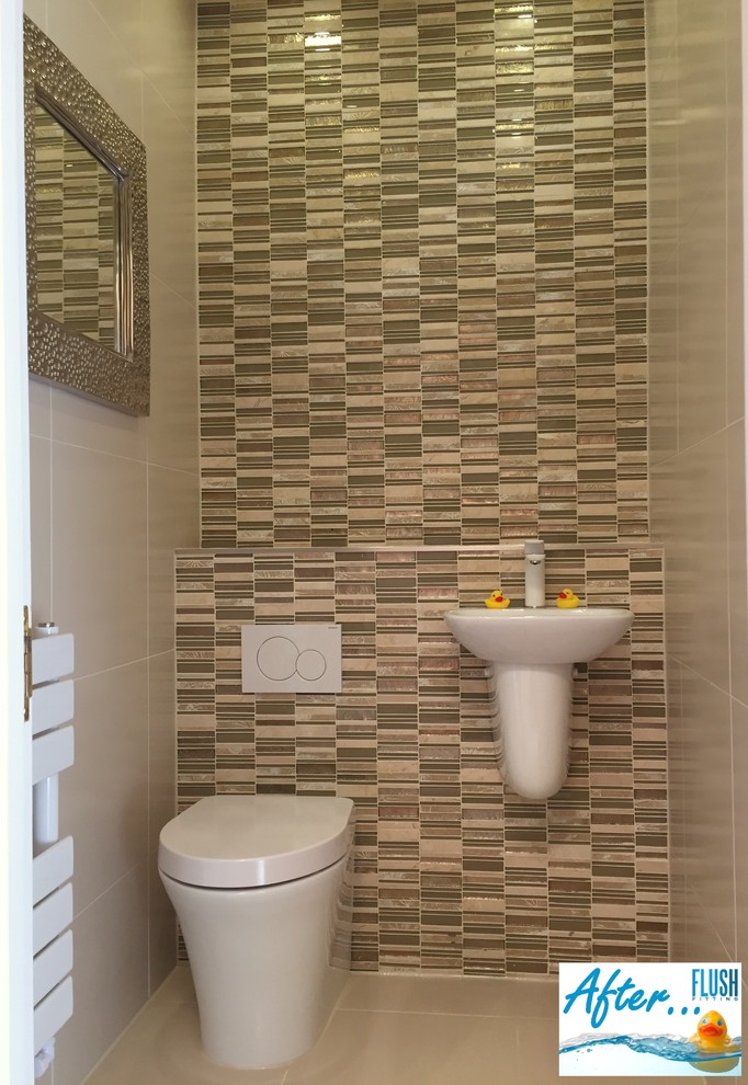 Photo of a small contemporary cloakroom in West Midlands with a one-piece toilet, beige tiles, porcelain tiles, beige walls, porcelain flooring and a wall-mounted sink.