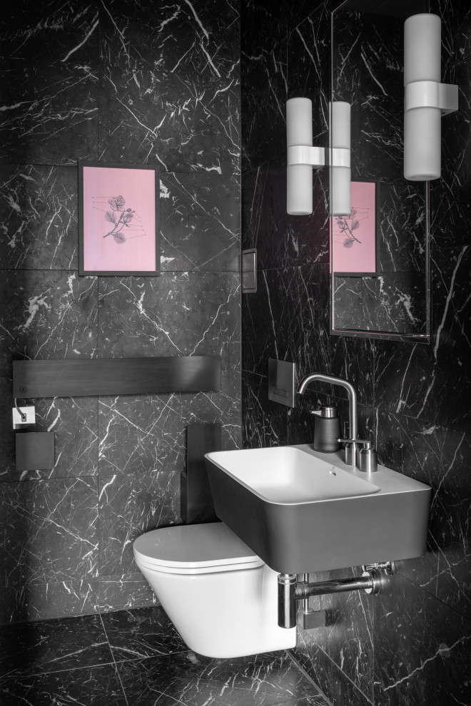 Photo of a small contemporary cloakroom in Edinburgh with a wall mounted toilet, black tiles, a wall-mounted sink, black floors and a floating vanity unit.