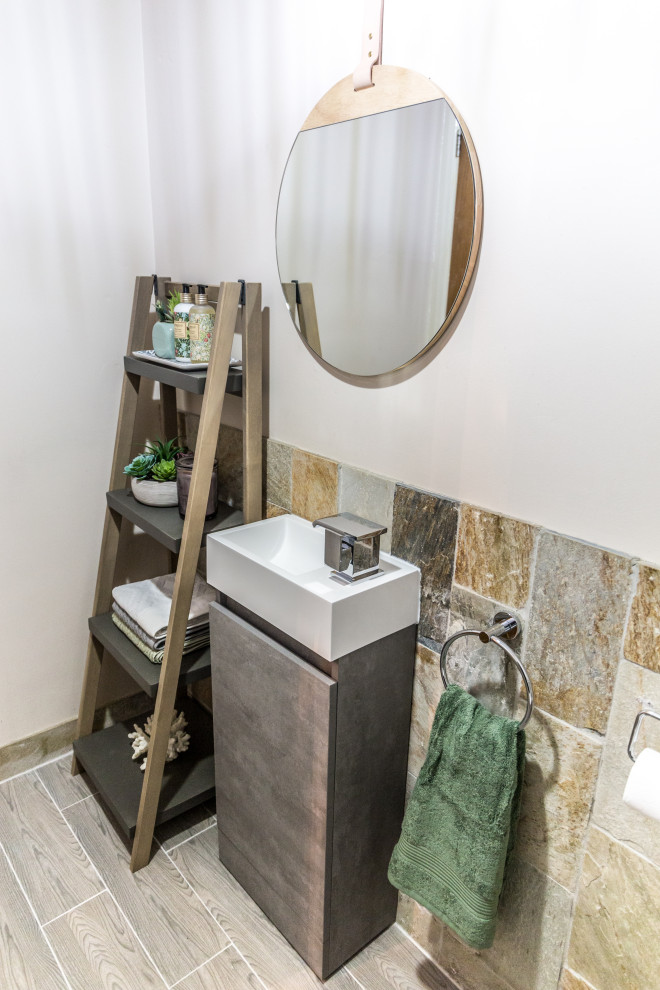 Small contemporary cloakroom in Other with flat-panel cabinets, grey cabinets, multi-coloured tiles, ceramic flooring and brown floors.