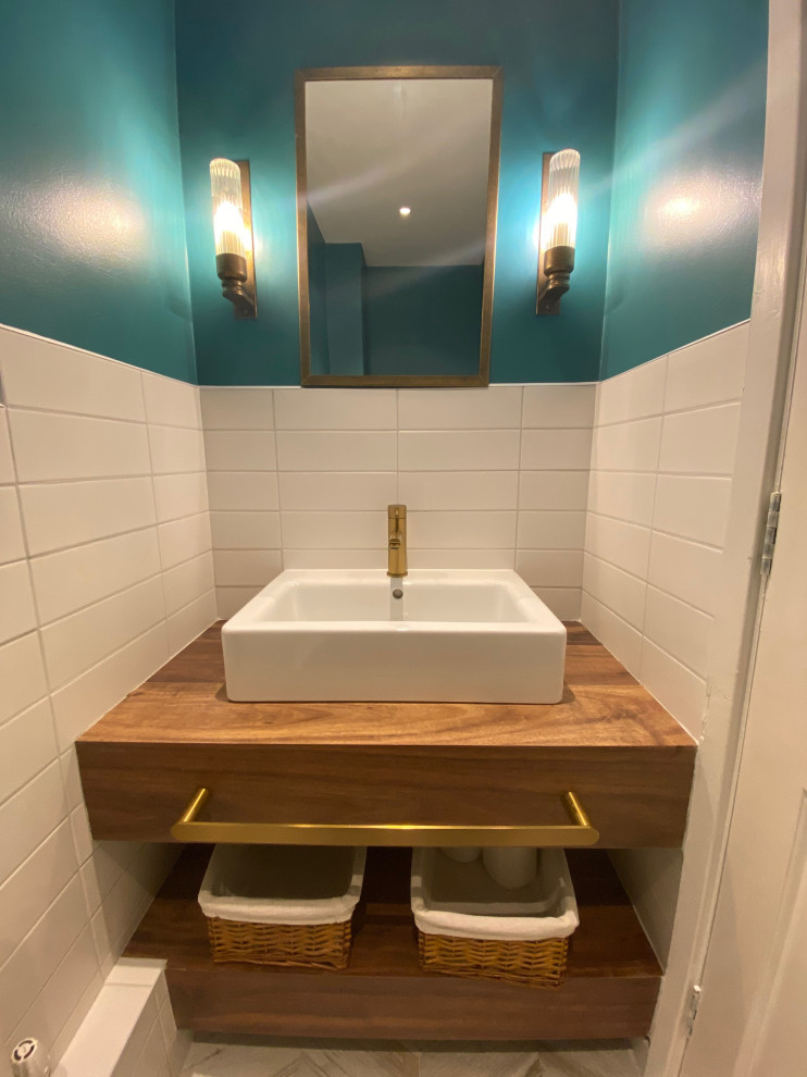 This is an example of a medium sized contemporary cloakroom in London.