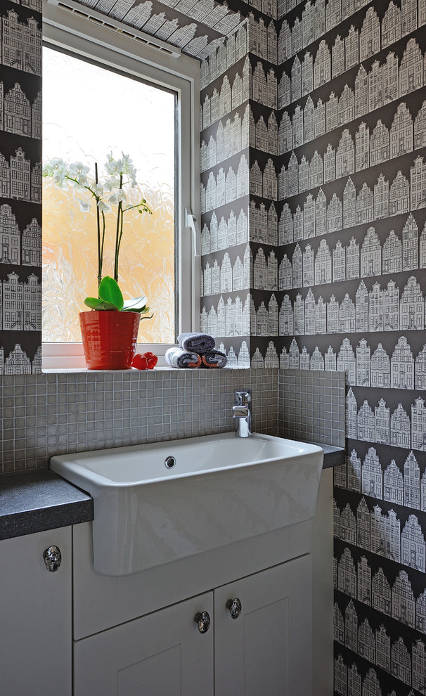 Example of a trendy powder room design in Hampshire