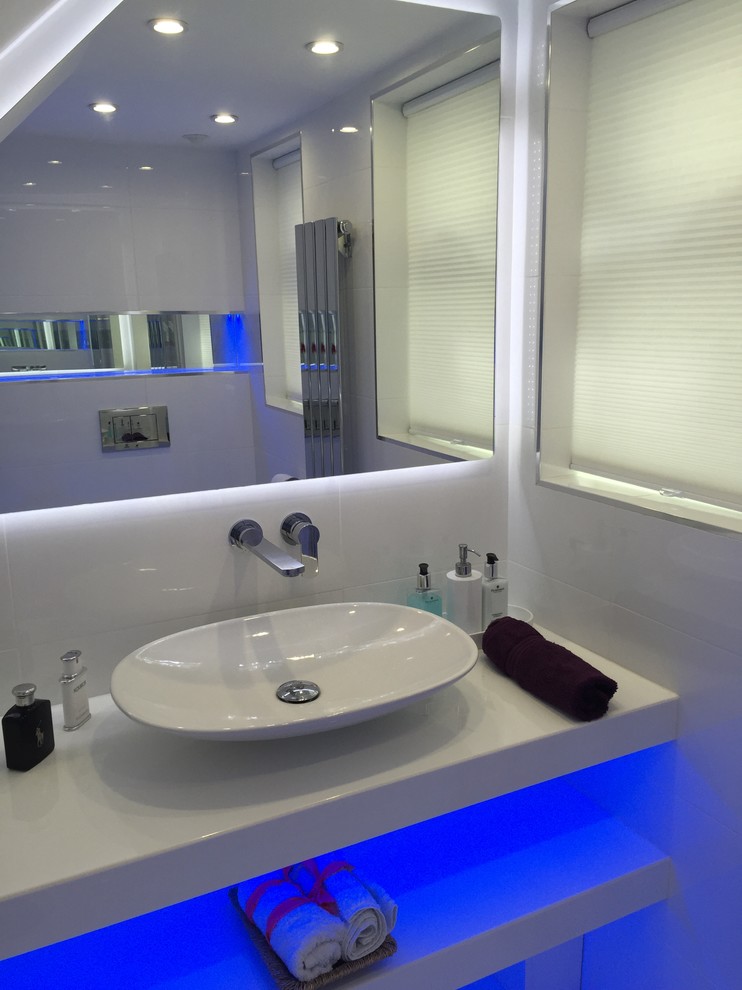 Inspiration for a medium sized contemporary cloakroom in London with a pedestal sink, quartz worktops, a wall mounted toilet, white tiles, ceramic tiles, white walls and porcelain flooring.
