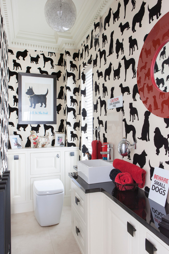 Eclectic powder room photo in Kent with a vessel sink
